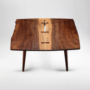 The Soojian Coffee Table hand-carved from California Walnut w/ hand-turned legs