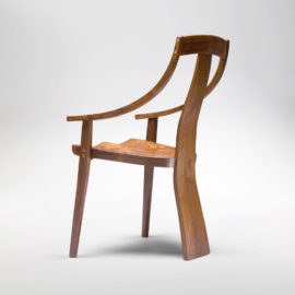 Side angle view of the Van Muyden Arm Chair, the first chair in the Erickson Bent Arm Collection