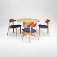Arnold kitchen table and dining chairs made from bleached maple, African bubinga and custom upholstery