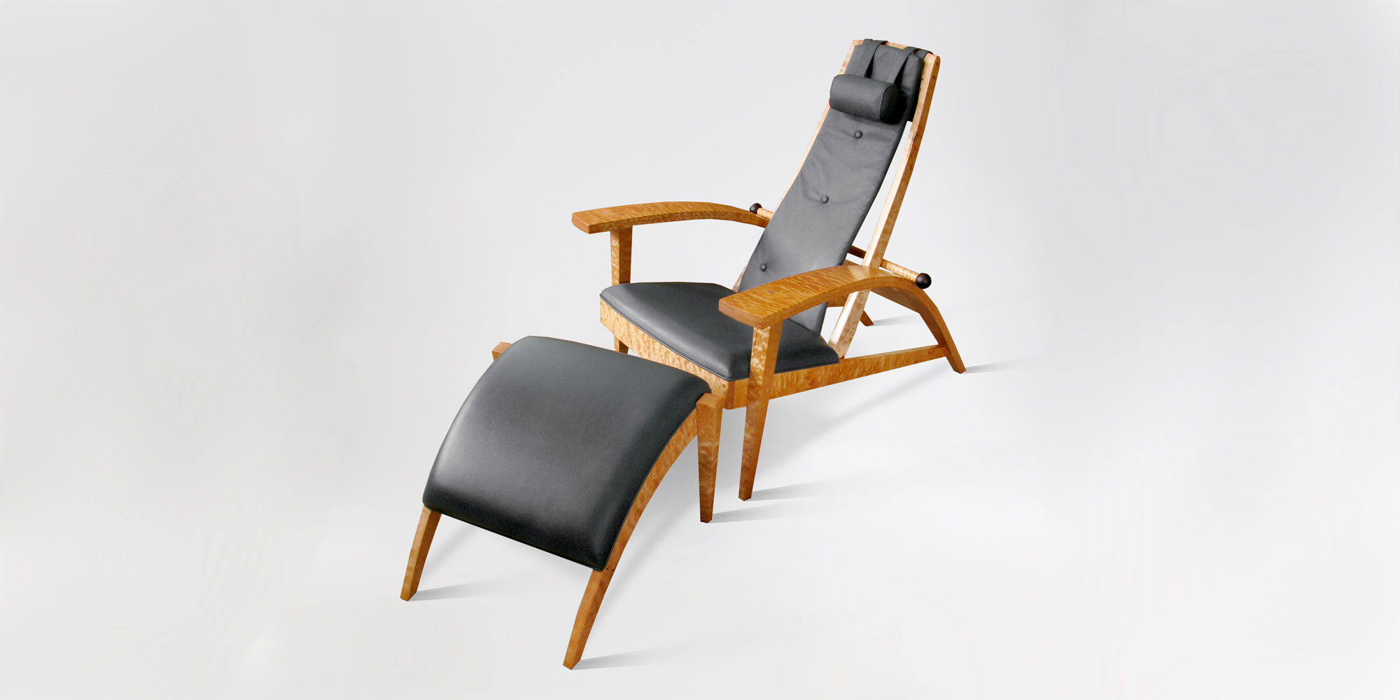 Our custom ergonomic Martinez Recliner w/ hand-sewn leather upholstery and foot stool