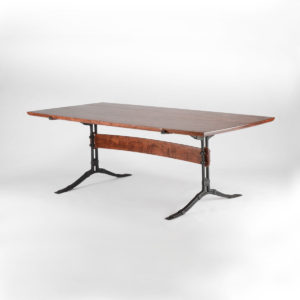 Our custom hand-carped Salin Dining Table w/ hand-forged steel trestles