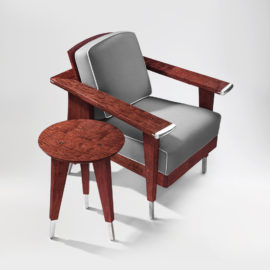 Front angle view of the Crane Upholstered Chair with custom bracketing and handmade upholstery